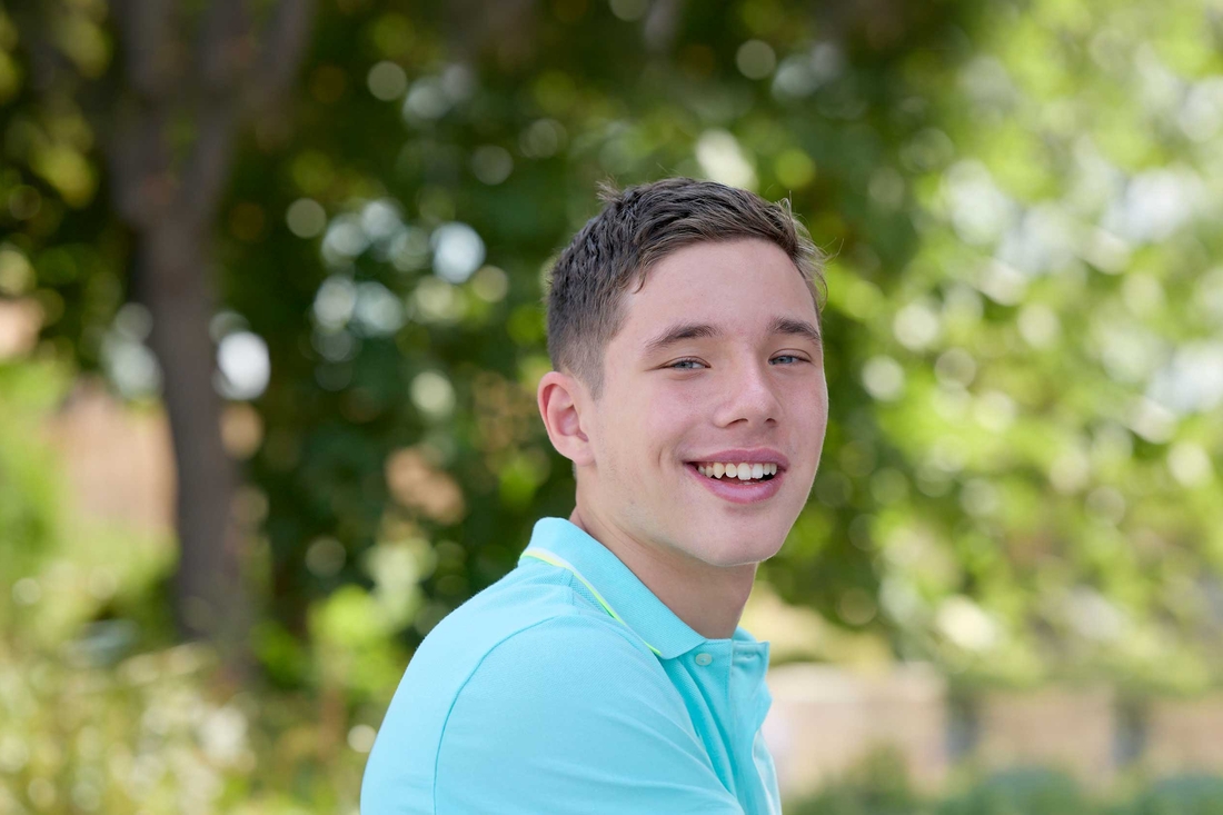 Smiling teenager with a blue shirt