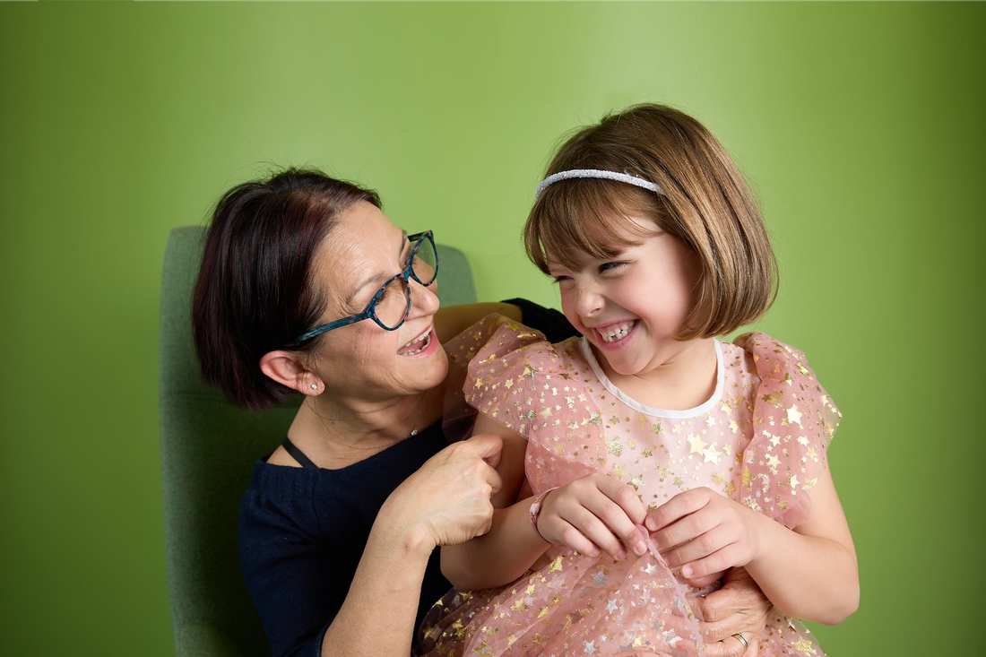 Grandmother hugging her granddaughter