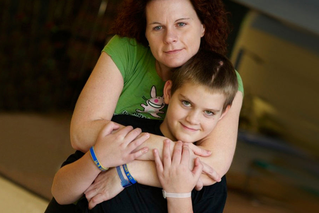 Mom hugging her son.