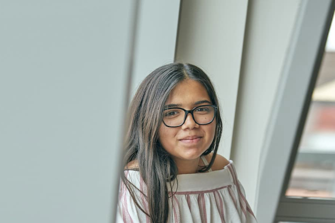 girl with glasses looking at viewer