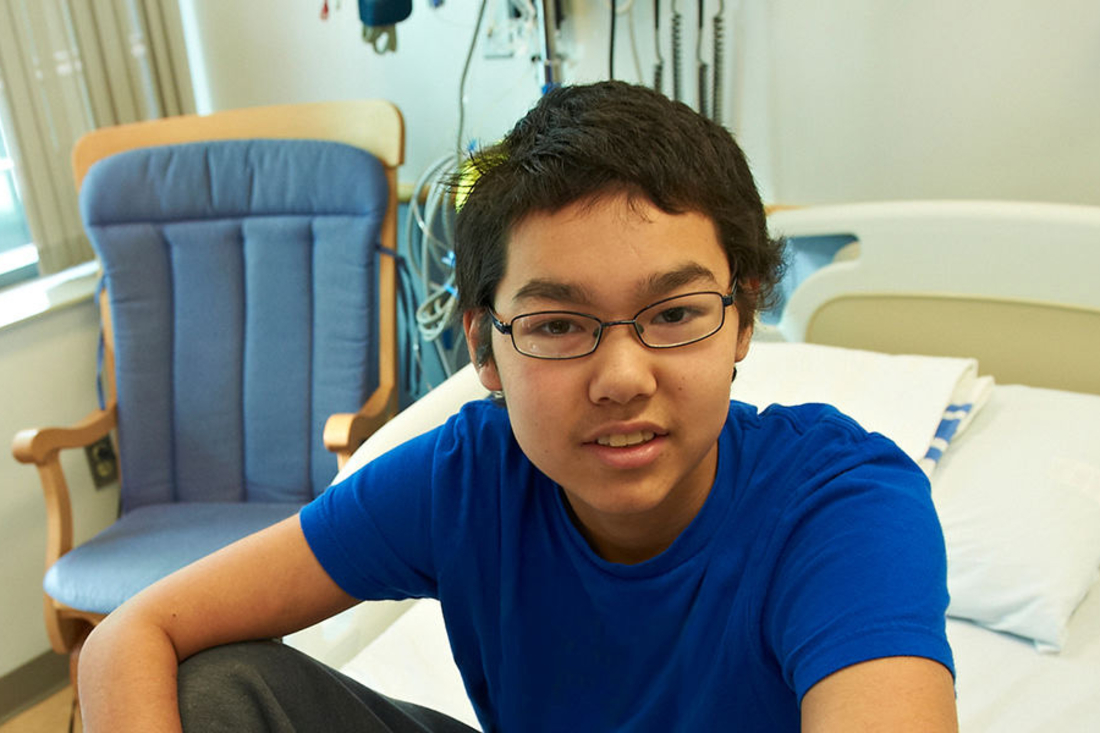 teen boy smiling at camera