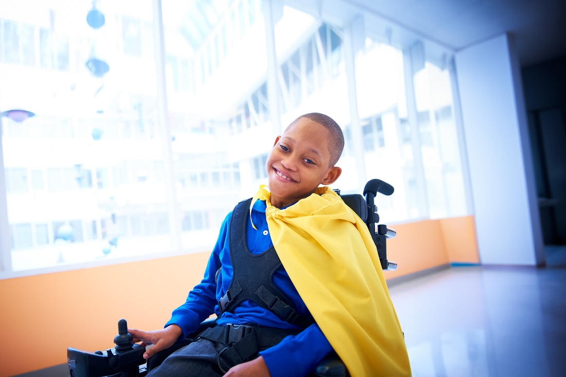 Patient posing with his yellow cape
