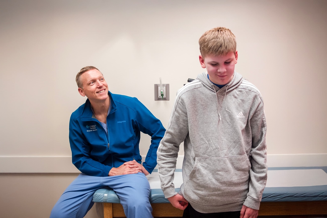 Pediatric epilepsy neurosurgeon Dr. Benjamin Kennedy with patient.