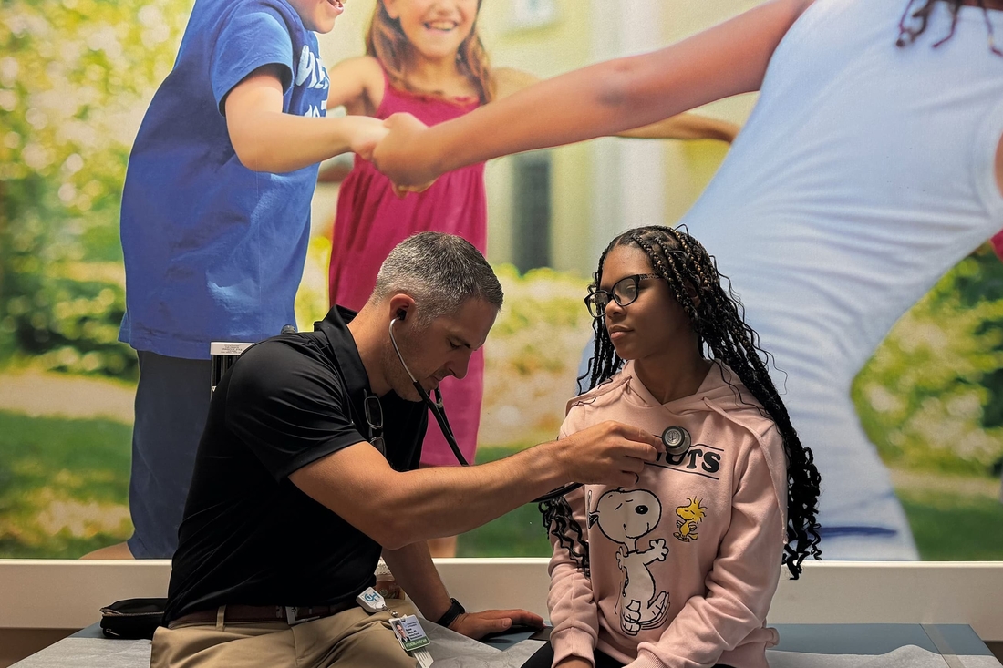 Saniyya with physician