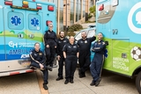 Transport team gathered amongst their emergency vehicles
