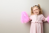 Blonde cardiac female patient wearing a pink dress and with a tracheostomy