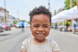 Closeup of young boy outside smiling