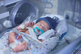 Baby with complex medical conditions resting remarkably peaceful