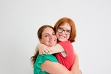 Mother and daughter hugging
