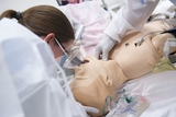 Team member working on mannequin