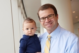 doctor holding a cute baby.