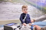 Young boy with epilepsy on exam table in doctor office.