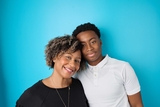 Mother and son on a blue wall