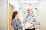 Two residents discussing a case.