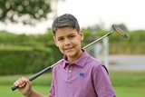 Young Golf Classic participant holding club
