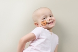 Young CHOP cancer patient smiling