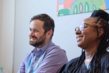 A pair of smiling staff members