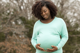 Pregnant woman walking outside