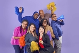 A group of Environmental Services staff cheering with pom poms.
