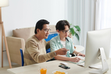 Father with son on computer