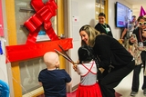 Patients and families cutting ribbon