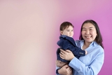 Mother holding her infant child