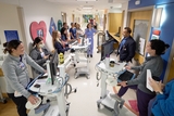 Doctor pointing at a screen while talking to his colleague.