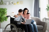 Mother with son in wheelchair