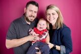 Smiling family with baby