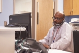 Man on phone in call center