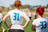 Two girls playing flag football