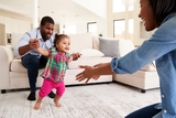 Baby taking her first steps