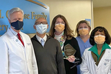 Group photo of CFDT team holding award