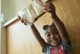 Child holding a sandwich