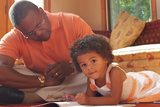father sitting with young daughter