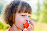 little girl with inhaler