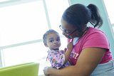 Mother holding young daughter Mother holding young daughter