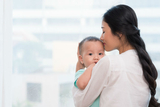 Mother holding young child