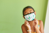 Young girl wearing a protective mask