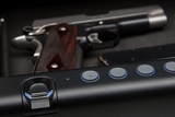 Gun sitting in electronic safe Gun sitting in electronic safe