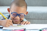 Young boy drawing a picture Young boy drawing a picture