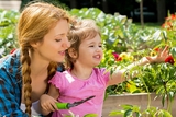 Mother and daughter in the garden Mother and daughter in the garden