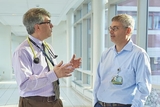 Drs. Behrens and Teachey talking Drs. Behrens and Teachey talking