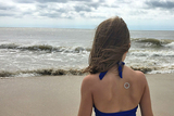 Girl on beach wearing patch Girl on beach wearing patch