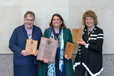 Group holding Special Service awards