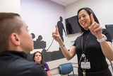 Doctor conducting eye test for concussion symptoms Doctor conducting eye test for concussion symptoms
