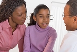 Doctor talking to patient and mother Doctor talking to patient and mother