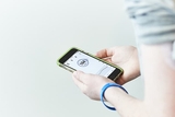 Teen using mobile app to monitor glucose level Teen using mobile app to monitor glucose level