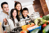 Delicious recipes from CHOP dietitians Family in kitchen cooking healthy meal together