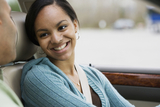 Teen girl driver in car smiling at father Teen girl driver in car smiling at father